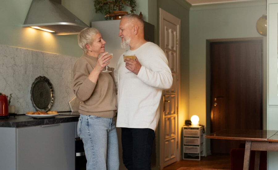 Canadian couple in the kitchen of their cottage as they contemplate selling and if they an avoid taxes.