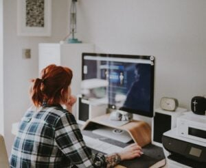 Woman working at desktop computer