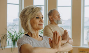 A couple enjoying a yoga class in their retirement