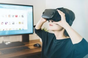 A woman wearing a pair of virtual reality goggles