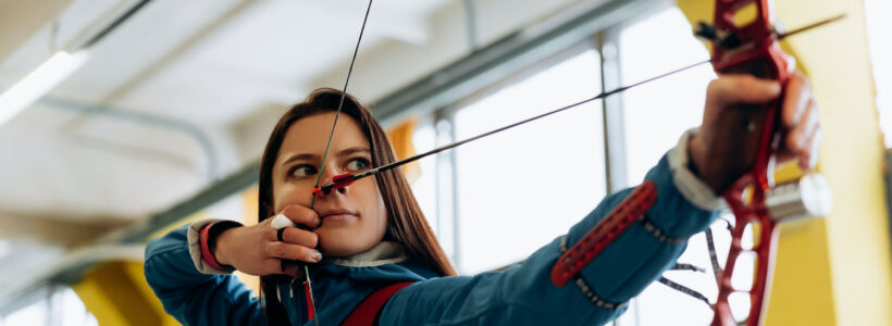 An archer with her eye on the target to symbolize Target Date Funds in Canada.