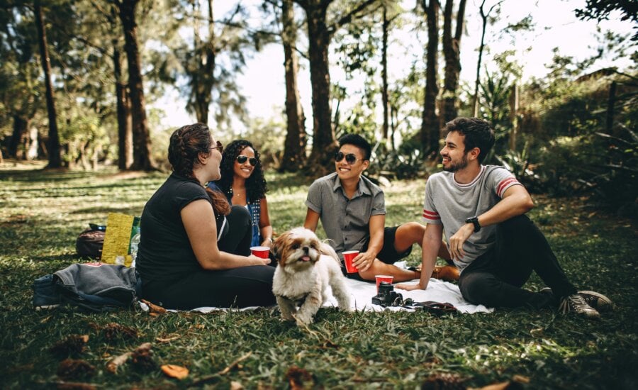 A group of friends is seen hanging out with eachother.