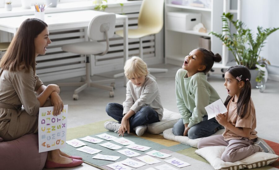 children and caregiver at daycare centre