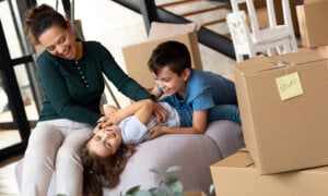 A Canadian family moving, thanks the BoC rate cuts, which improved mortgage affordability in Vancouver, Toronto and Hamilton