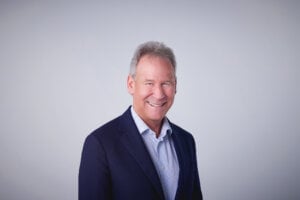 A head shot of Allan Norman on a white background.