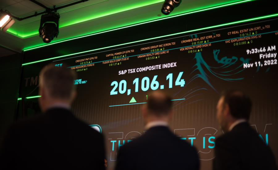 Traders watch a ticker screen at a stock exchange