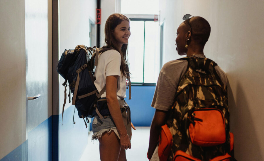 Two Canadian students at a dorm discussing RESP withdrawal rules.