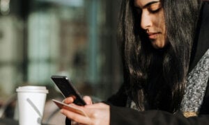 Canadian woman looking at her credit score after realizing she left her credit card dormant.