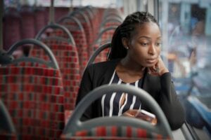 woman commuting to work on bus