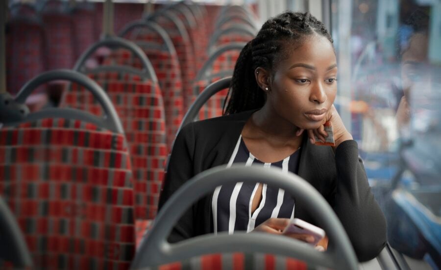 woman commuting to work on bus