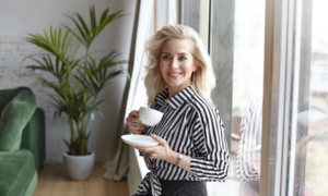 Woman drinking tea in her lovely home