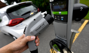 A car parked at an EV charging station