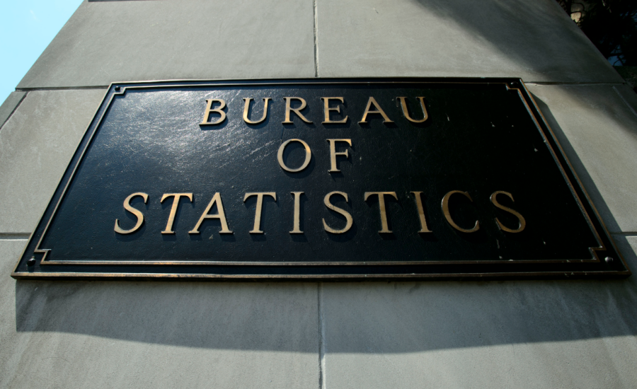 A plaque on a building with the words Bureau of Statistics