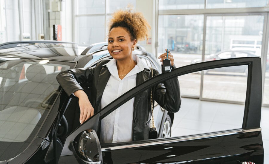 Canadian woman buying a car, as she learns to manage her money.