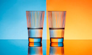 Two glasses shown half-full to demonstrate the optimism from investment advisor Allan Small.