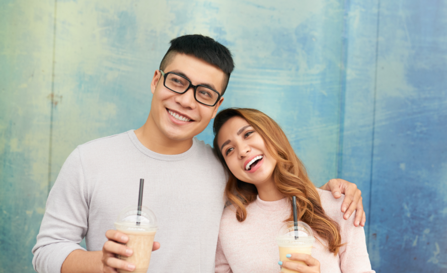 Young and woman drinking iced coffee