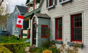 House with Canadian flag: Will the housing markets open with the Bank of Canada's Jan. 29 rate announcement?