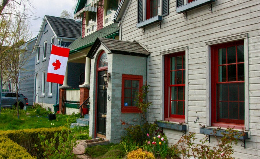 House with Canadian flag: Will the housing markets open with the Bank of Canada's Jan. 29 rate announcement?