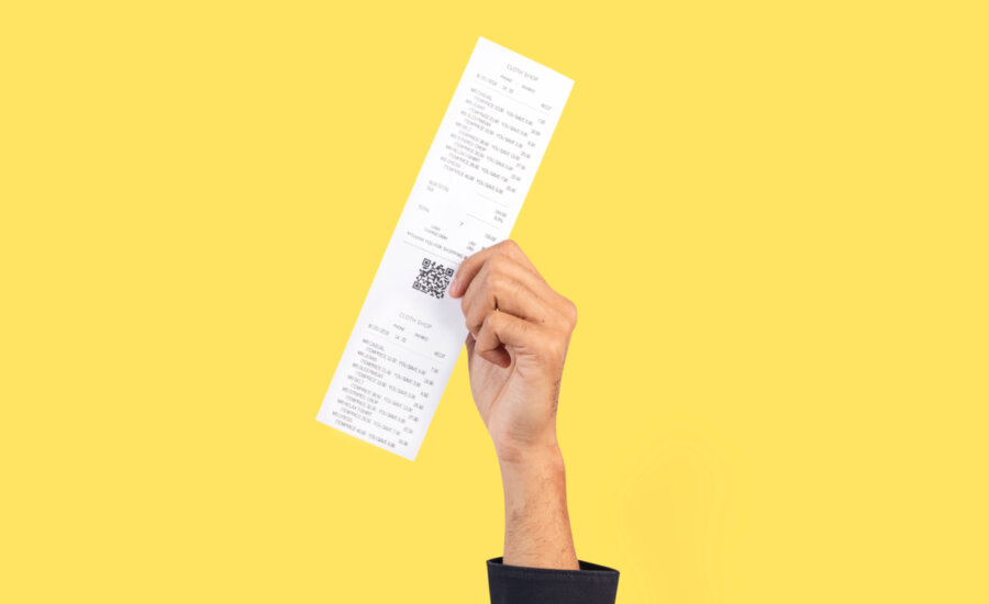 A Canadian holding on to a receipt for their income tax filing.