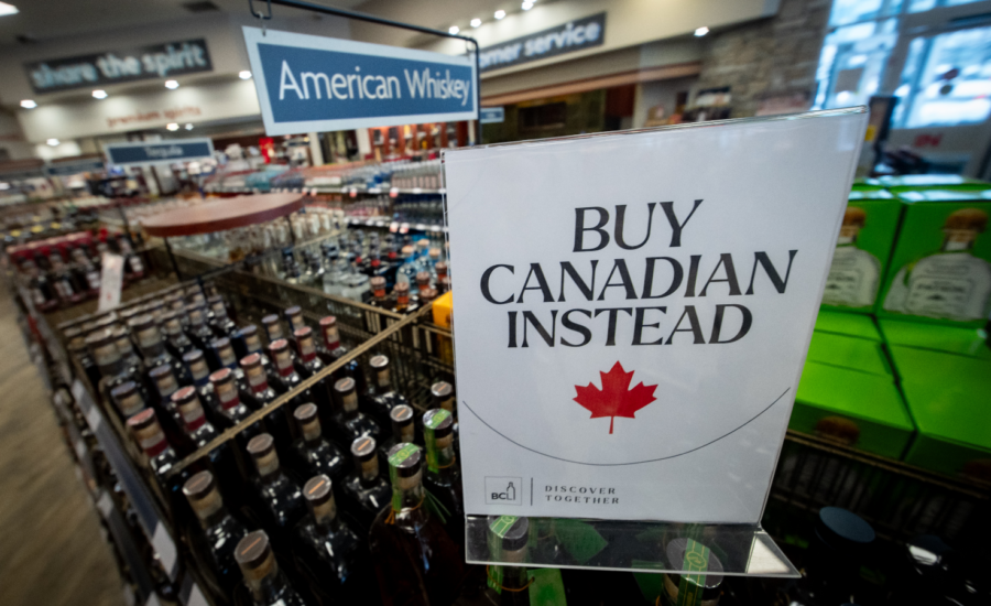 A sign in a liquor store that says Buy Canadian Instead