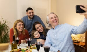 Canadian parents with their adult children, having a good time, spending money on a dinner, knowing they have money in the estate for their adult kids. Is life insurance the answer?